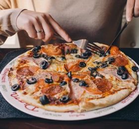 Woman eating pizza